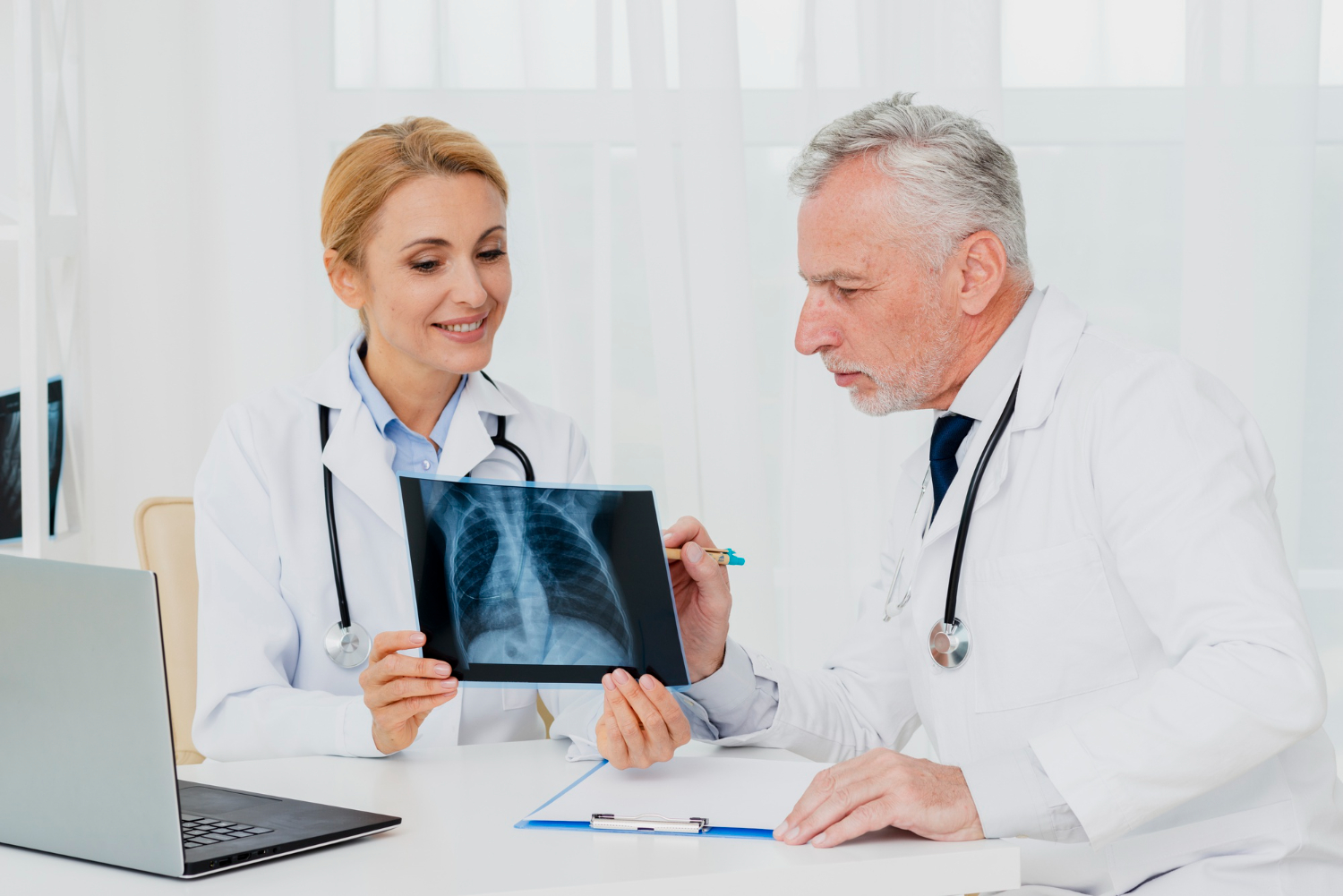 Chiropractors in Oakbrook dicussing patient's X-ray.
