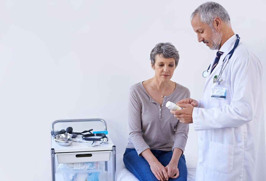 Hospital consulting and doctor with pills for woman for prescription medicine and treatment Healthcare medication and senior person in consultation for medical service wellness and diagnosis