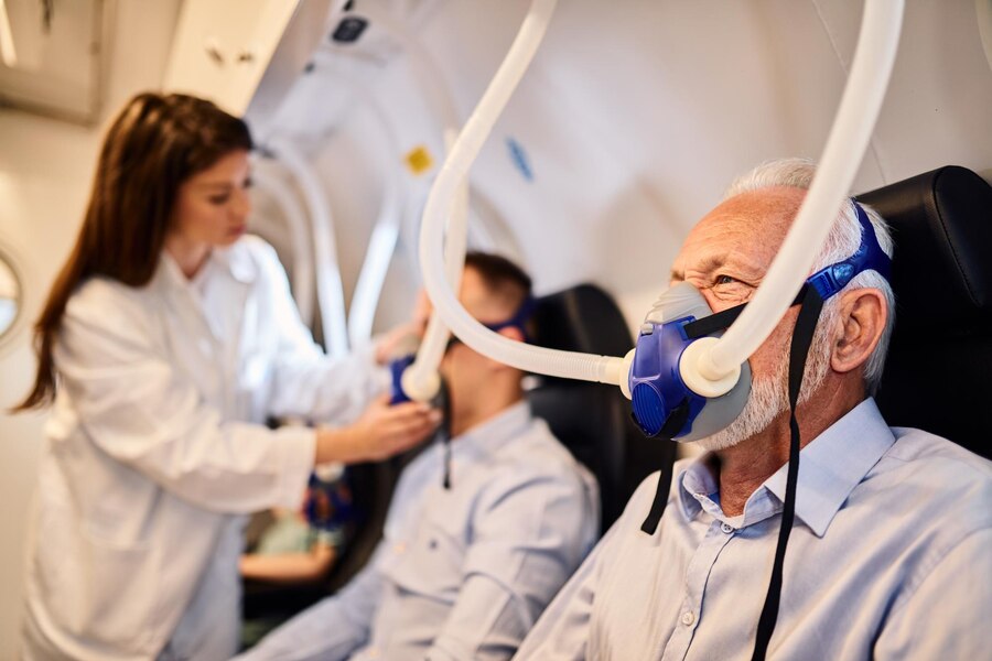 senior-man-breathing-through-mask-oxygen-therapy-hyperbaric-chamber